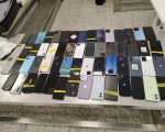 Pai e filho são presos no Aeroporto de Confins com mais de 100 celulares suspeitos